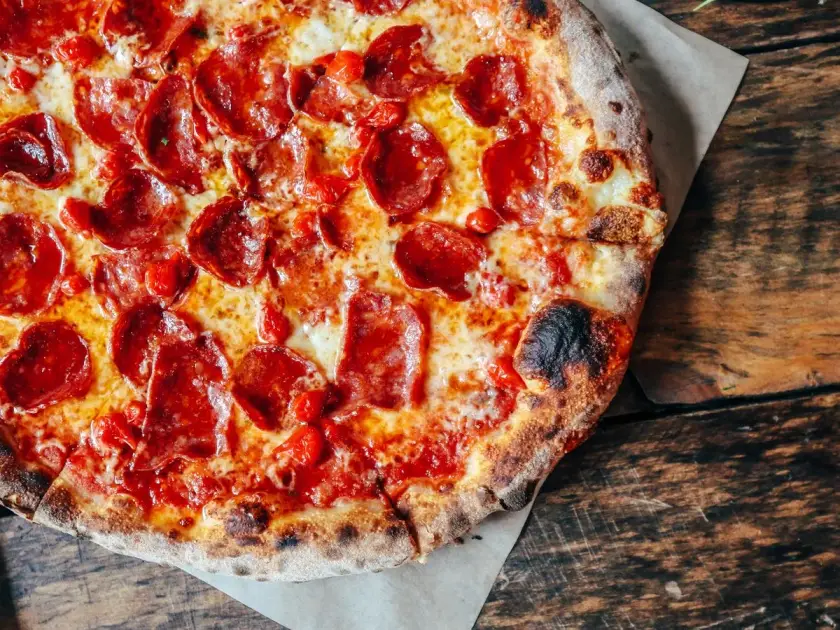 Wood-fired pizza at Renzo's Pizzali kitchen