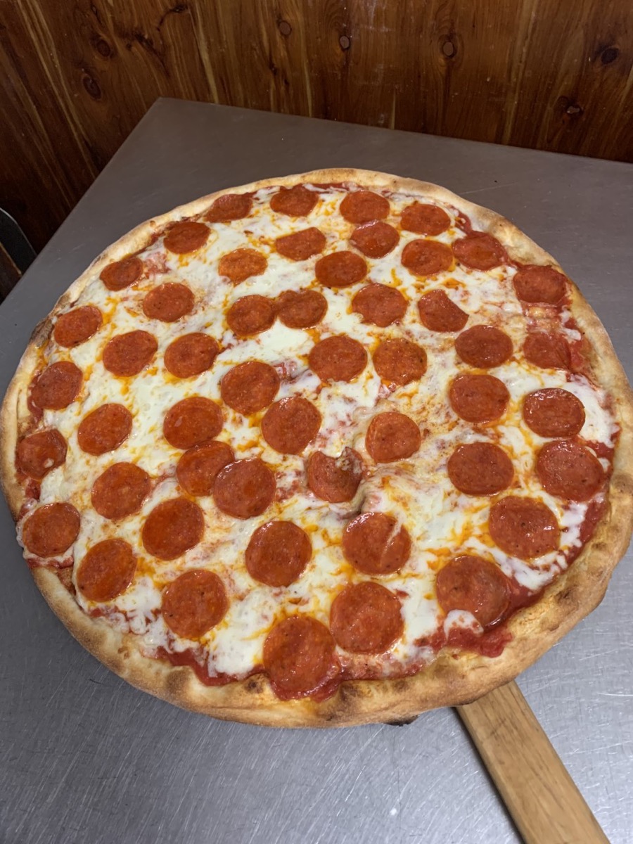 Fresh pizza from Renzo's Pizzali kitchen
