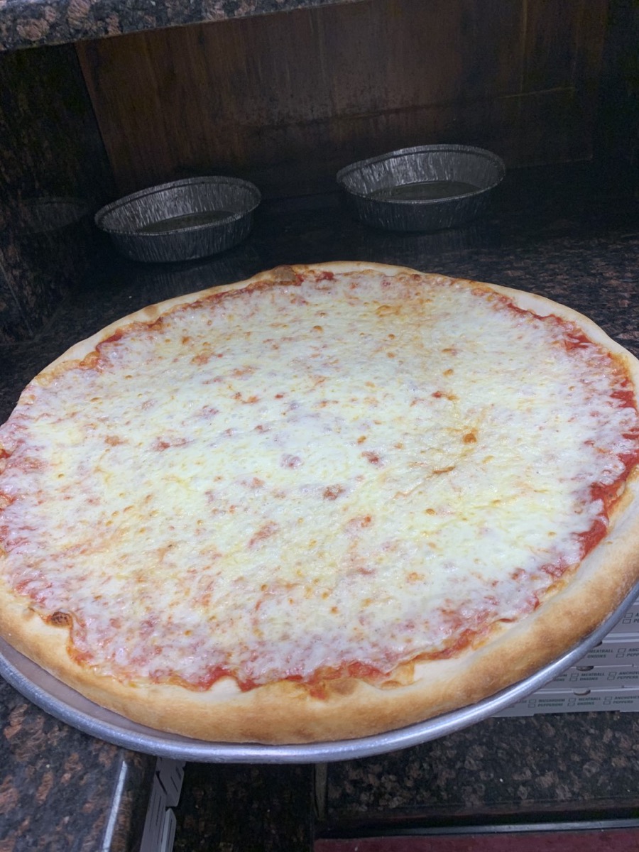 Renzo's Pizzali food spread